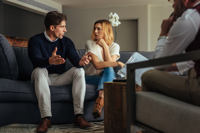 Couple Arguing during Therapy Session with Psychologist